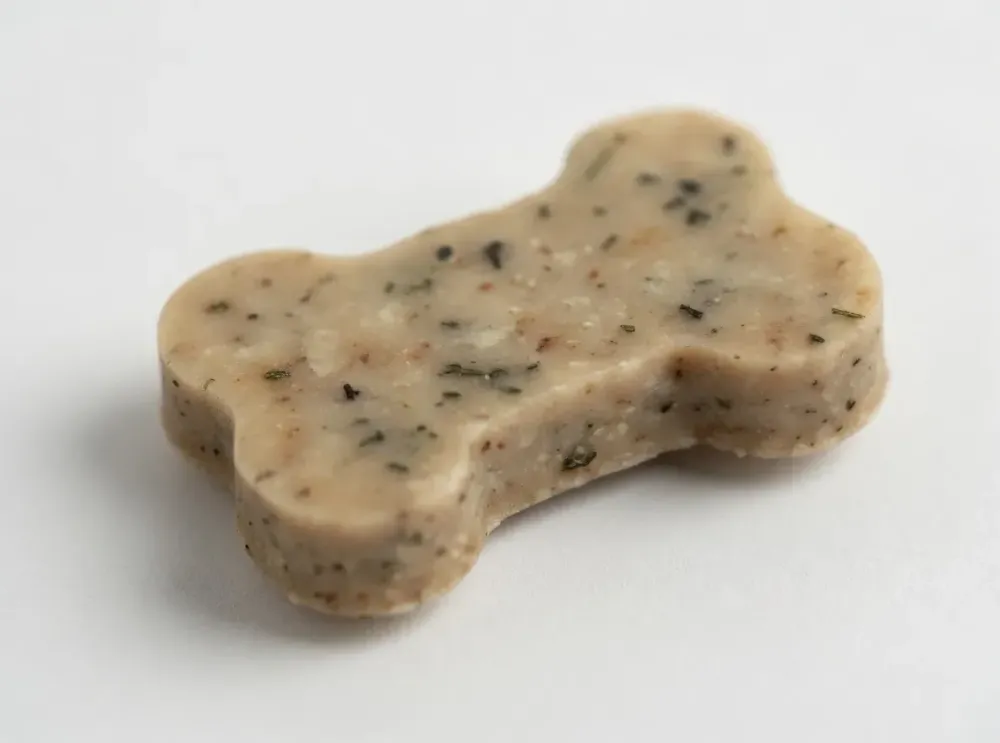 A close up a single Derma-Pure chew for larger breeds