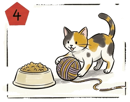 a cute kitten is distracted playing with a ball of yarn